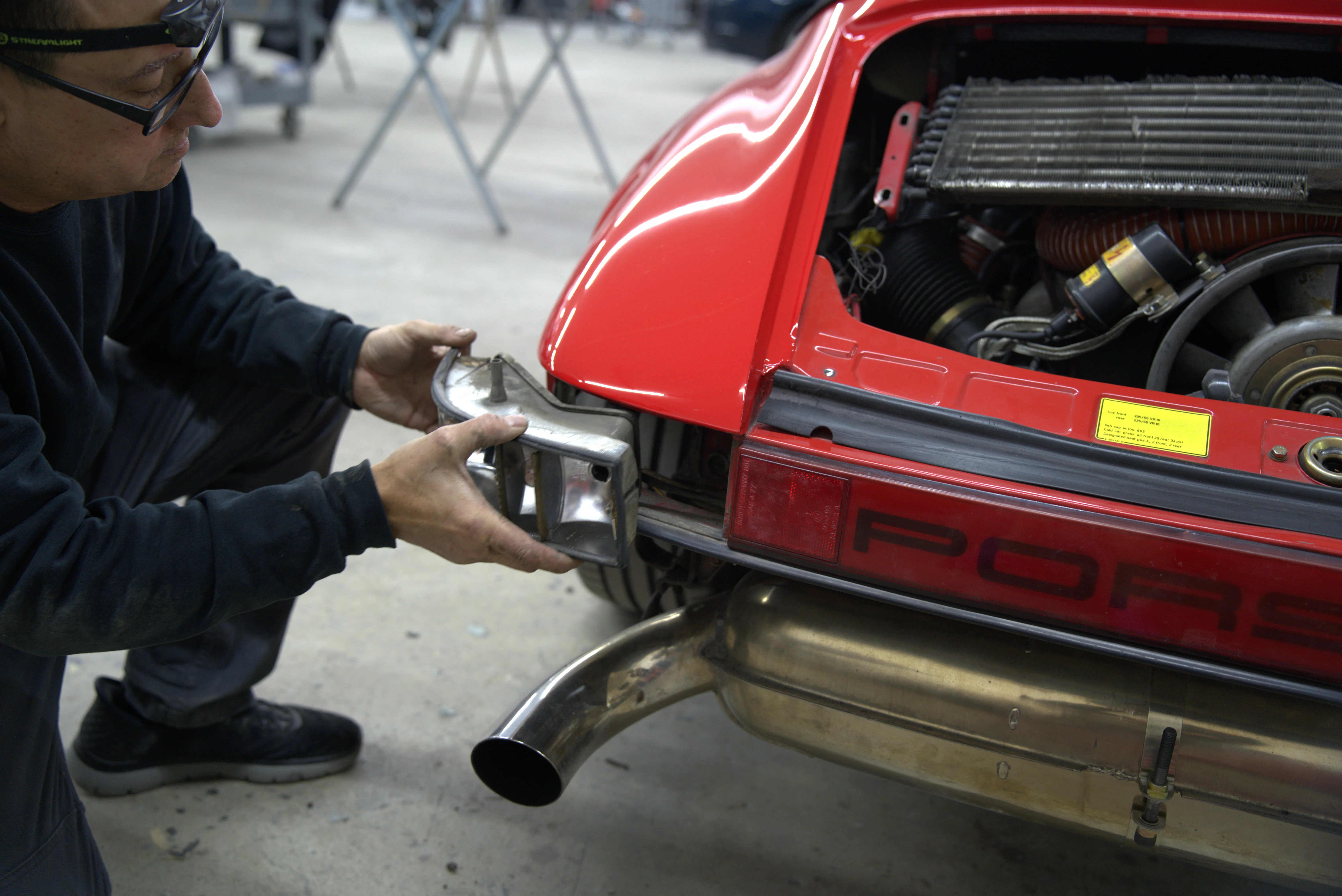Professional dent repair technician working on vehicle panel at Five Star Auto Body Longview WA location on Commerce Avenue